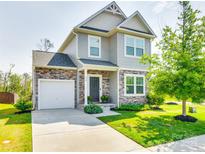 Two-story house with gray siding, stone accents, and a landscaped lawn at 970 Bunker Trce, Rock Hill, SC 29730