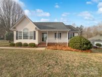 Ranch house with front porch, landscaping, and a brick foundation at 1002 Joanne Ct, Kings Mountain, NC 28086