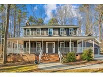 Two-story house with wraparound porch and large backyard at 14264 Maple Hollow Ln, Mint Hill, NC 28227