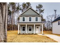 Two-story house with gray siding, white columns, and a front yard at 207 Benfield Rd, Kings Mountain, NC 28086