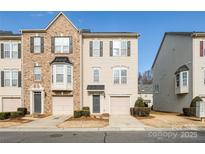 Attractive 2-story townhome with neutral exterior and 2-car garage at 2151 Belle Vernon Ave, Charlotte, NC 28210