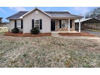 Charming one-story house with stone accents and a covered porch at 3164 River Rd, Lincolnton, NC 28092