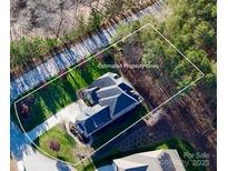An aerial view showcases the property lines of this wooded lot at 407 Blue Bay Ct, York, SC 29745