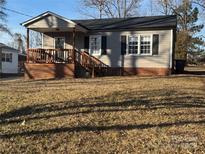 Ranch home with a covered porch and landscaped yard at 604 Kimball St, Kannapolis, NC 28081