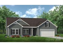 Gray exterior of charming one-story home with landscaped lawn at 6327 Honor Ave, Midland, NC 28107