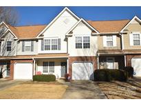 Two-story townhome with brick facade and attached garage at 11646 Rabbit Ridge Rd, Charlotte, NC 28270