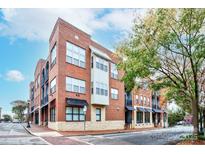 Brick building with multiple units and street-level retail spaces at 119 S Lee St, Salisbury, NC 28144