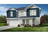 Two-story home with blue and gray siding, a white door, and a two-car garage at 12131 Plummer Ct # 1, Midland, NC 28107