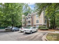 Exterior view of a charming condo building with ample parking at 2514 Cranbrook Ln # 5, Charlotte, NC 28207