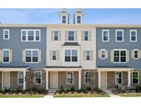 Three-story townhouses with neutral siding and stone accents at 4362 Reed Creek Dr, Sherrills Ford, NC 28673