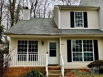 Charming two-story home with vinyl siding and a brick base at 6411 Windsor Gate Ln # 31/6411, Charlotte, NC 28215