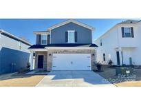 Two-story house with gray siding, brick accents, and a two-car garage at 1260 31St Ne St, Hickory, NC 28613