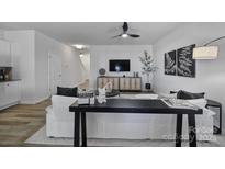 Bright living room with modern furniture and hardwood floors at 176 Briana Marie Way, Indian Trail, NC 28079