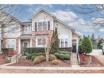 Tan two-story townhome with stone accents and landscaping at 201 Waterlynn Ridge Rd # E, Mooresville, NC 28117