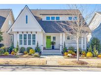 Charming two-story home with white siding, green door, and landscaped yard at 324 Mill Ridge Rd, Rock Hill, SC 29730