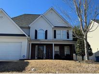 Charming two-story home featuring a brick porch and a manicured front lawn at 3865 Parkers Rd, Fort Mill, SC 29715