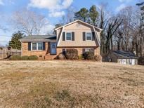 Brick ranch home with attached garage and spacious yard at 4532 Oakwood Cir, Gastonia, NC 28056