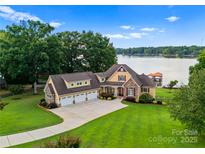 Luxury lakefront home with 3-car garage, expansive lawn, and private dock at 7919 Bankhead Rd, Denver, NC 28037