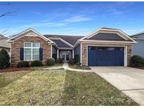 Inviting ranch home with stone accents and a two-car garage at 9140 Carneros Creek Rd, Charlotte, NC 28214