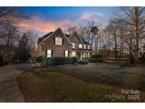 Brick two-story house with landscaping and driveway at 1102 Dobson Dr, Waxhaw, NC 28173