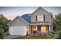 Charming two-story home featuring stone accents, a welcoming porch, and attached two-car garage at 1386 6Th Ne St, Hickory, NC 28601