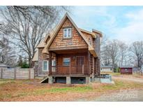 A charming A-frame home with wood siding and a spacious deck at 1505 S Ridge Ave, Kannapolis, NC 28083