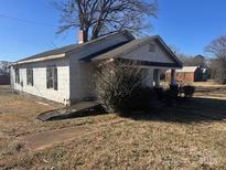 Ranch style home with front porch and yard at 1810 E Greenbriar Rd, Statesville, NC 28625