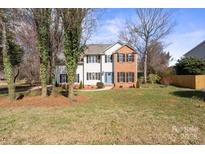 Charming two-story home with a combination of white siding and brick, complemented by a well-maintained front yard at 212 Catalina Dr, Mooresville, NC 28117