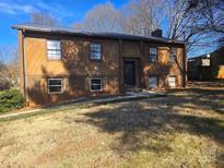 Brick and wood siding ranch home with a spacious yard at 5636 Sandhurst Rd, Hickory, NC 28602