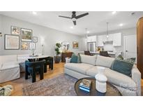 Open living area with modern sofa, dining table, and kitchen views at 203 Grandin Rd # 3, Charlotte, NC 28208