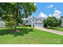 Charming two-story home with a well-manicured lawn, two-car garage, and inviting curb appeal at 247 Aylesbury Ln, Indian Trail, NC 28079
