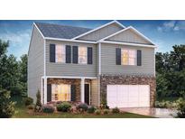 Two-story house with stone accents and a two-car garage at 3103 Winged Elm St, Gastonia, NC 28056