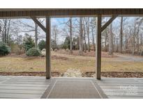 A view of the front yard from the covered porch at 4530 Meandering Way, Conover, NC 28613