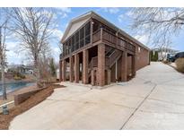 Lakefront home with spacious deck and screened porch at 182 Grand View Dr, New London, NC 28127