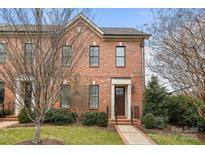 Charming two-story red brick home with a manicured front yard and inviting entrance at 2218 Croydon Rd, Charlotte, NC 28207