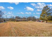 Ranch style brick house with large yard and detached garage at 421 Wood Bridge Rd, Statesville, NC 28625