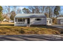 Charming ranch home with front porch and mature landscaping at 120 Moyle Ave, Salisbury, NC 28146