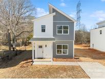 Modern two-story home with gray and white exterior, and a small front yard at 2041 Greenoak Dr, Shelby, NC 28152