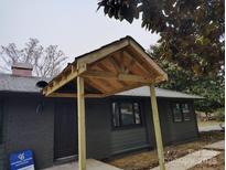 Newly constructed front porch with a stylish wood frame at 3027 Remington St, Charlotte, NC 28216