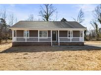 Newly constructed craftsman style home with front porch and landscaped yard at 344 Luther Scronce Rd, Vale, NC 28168