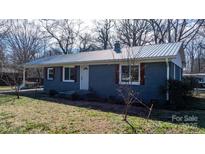 Charming single-story brick home featuring a new metal roof and lovely curb appeal at 3021 Tryon Courthouse Rd, Bessemer City, NC 28016