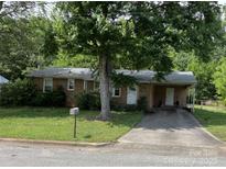 Brick ranch house with carport and mature landscaping at 312 Fulton St, Kings Mountain, NC 28086
