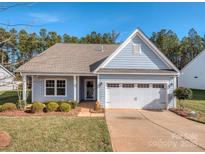 Nice curb appeal! Light blue house with 2 car garage and landscaping at 5220 Admirals Lndg, Lancaster, SC 29720