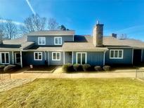 Charming two-story home with a stone chimney, well-maintained lawn, and inviting curb appeal at 1017 21St Ne Ave, Hickory, NC 28601