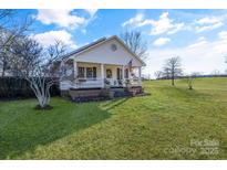 Charming white house with a brick porch and a well-maintained lawn at 2961 Great Falls Hwy, Lancaster, SC 29720