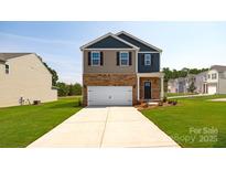 Two-story brick home with a two-car garage and landscaped lawn at 3048 Ora Smith Rd, Lincolnton, NC 28092