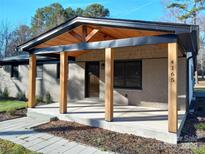 Ranch style home with covered porch and wood posts at 4165 Laurelwood Ct, Concord, NC 28025