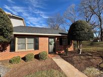 Brick ranch home with landscaping and walkway at 715 21St Ne Ave, Hickory, NC 28601