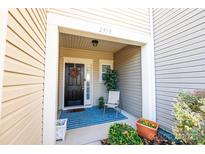 Inviting front entrance with a charming porch and landscaping at 2519 Early Flight Dr, Charlotte, NC 28262