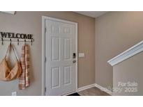 Inviting entryway with coat hooks and stylish decor at 3024 Ora Smith Rd, Lincolnton, NC 28092